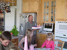 Ken brings the cake....