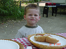 Hunter enjoys a BBQd hot dot lunch.