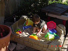 Hunter playing in his sand box.