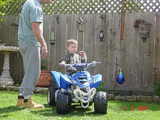 Hunter riding his ATV