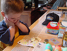 Hunter decorating eggs.