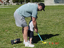 Dave and Hunter practice swinging