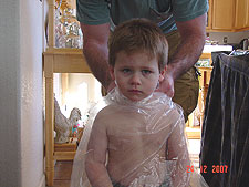 Hunter gets a haircut from dad.