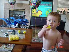 Hunter playing with a bag of practice golf balls.