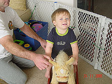 Hunter on his rocking horse.